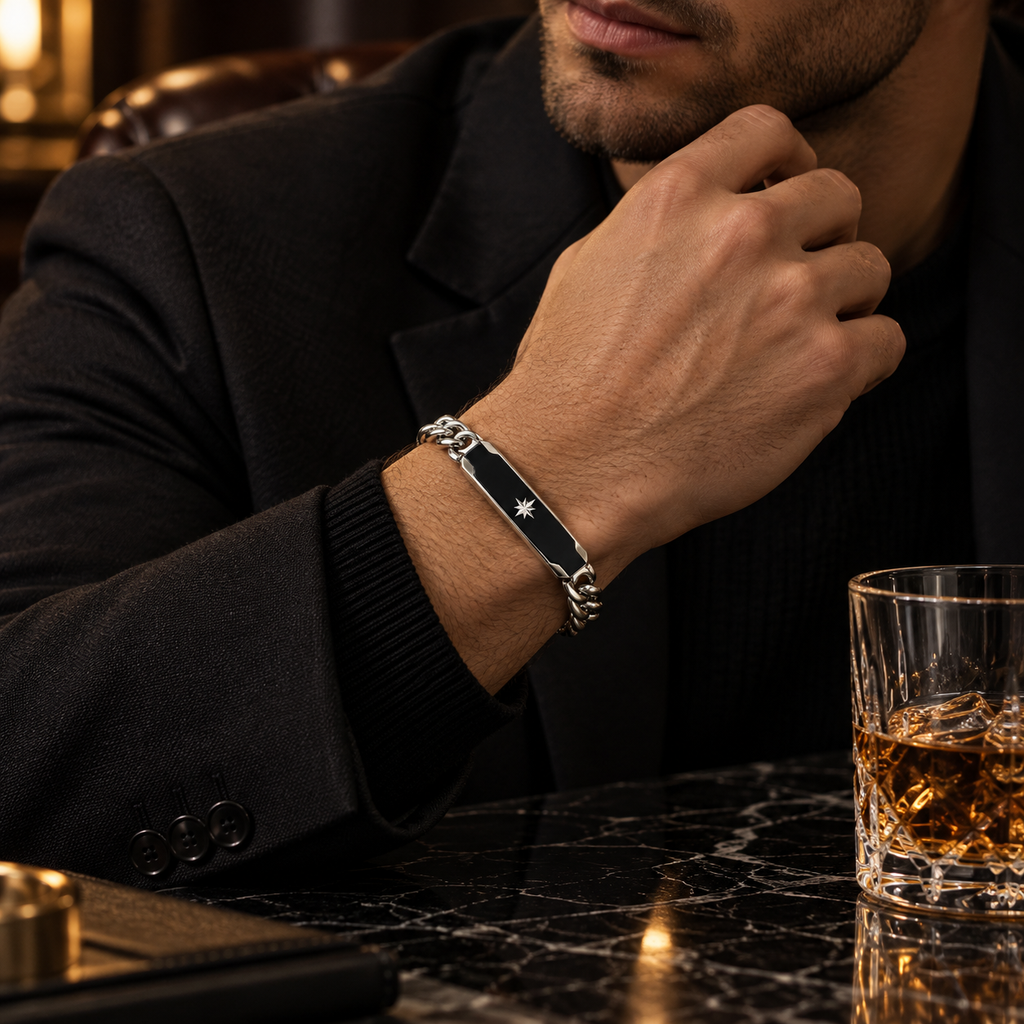 Model wearing men's black enamel Cuban link ID bracelet with formal black suit
