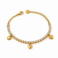 Women's 18K gold-plated CZ tennis bracelet featuring sparkling round crystals and three dangling puffed heart charms with lobster clasp.
