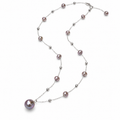 Women's baroque lavender pearl station pendant necklace with stainless steel chain on white background
