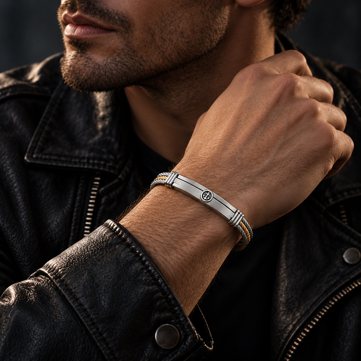 Model wearing men's two-tone steel cable anchor bracelet with black leather jacket
